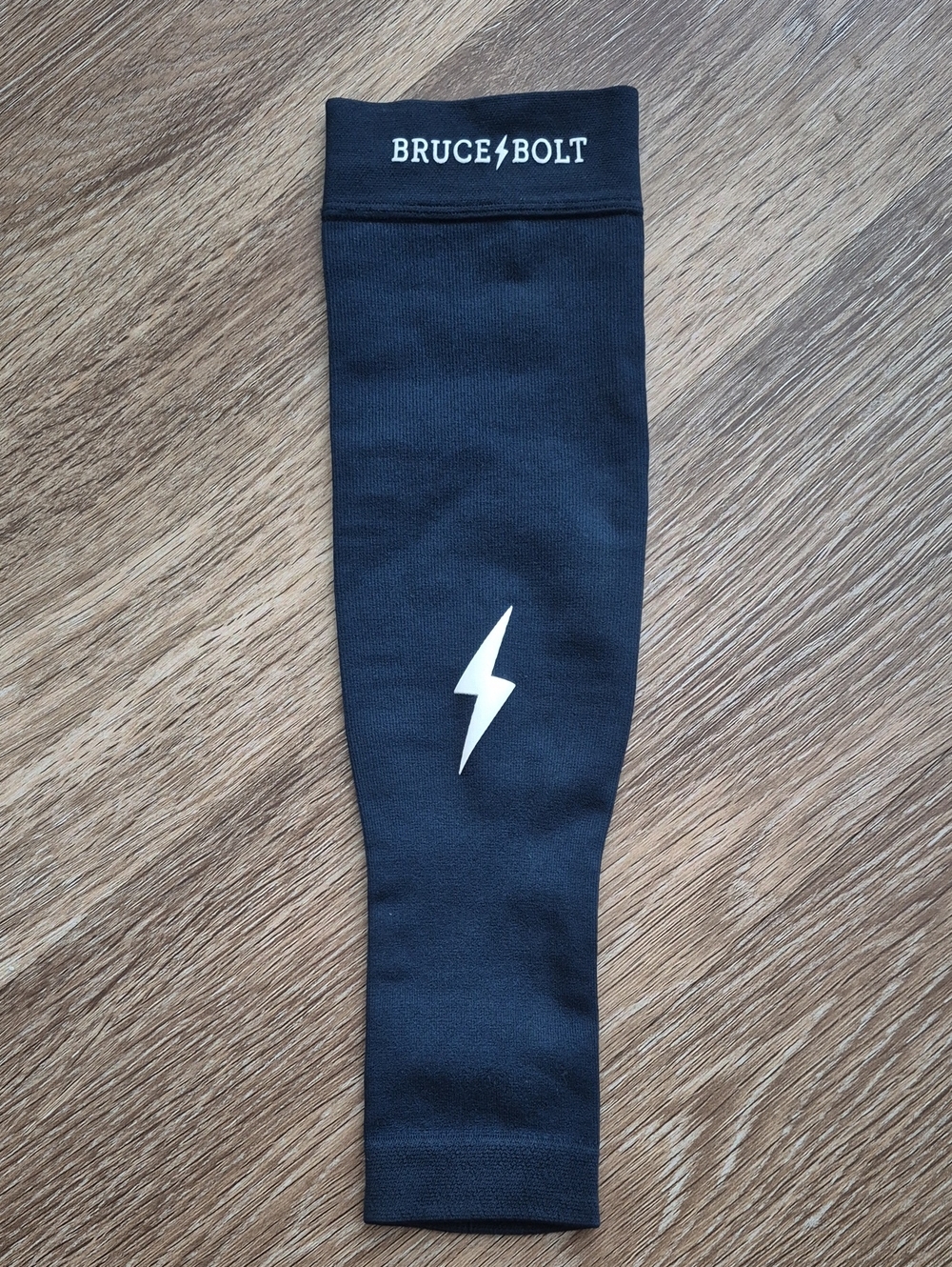 Bruce Bolt Kids Black Athletic Sleeve with White Bolt Logo NWOT